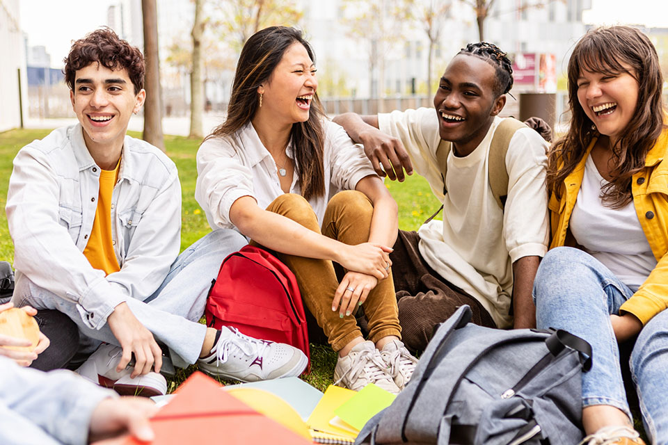 group of students gather outside after school